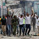 Protesters supporting opposition leader Raila Odinga attempt to make peace with policemen in Mathare, in Nairobi, Kenya
